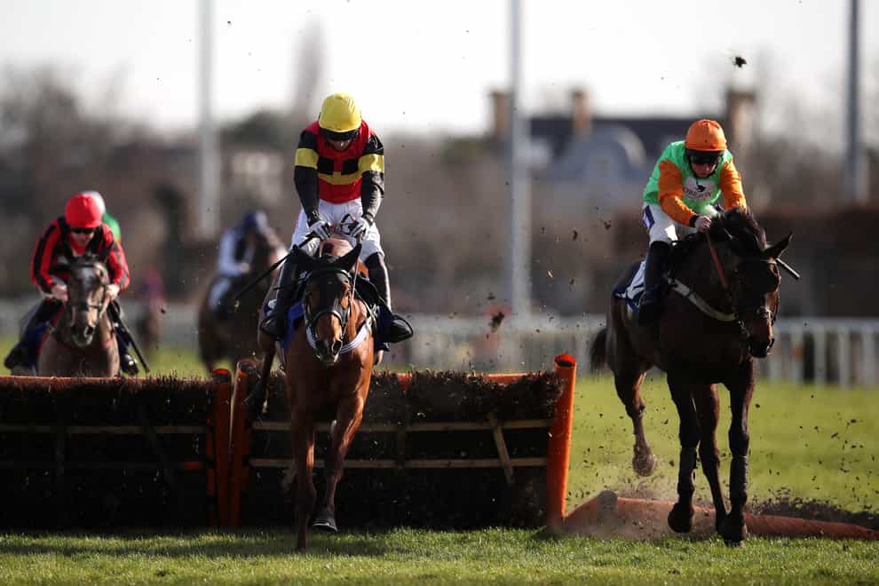 Knight Salute (left) ridden by jockey Paddy Brennan on their way to winning the Coral Adonis Juvenile Hurdle at Kempton Park racecourse. Picture date: Saturday February 26, 2022.