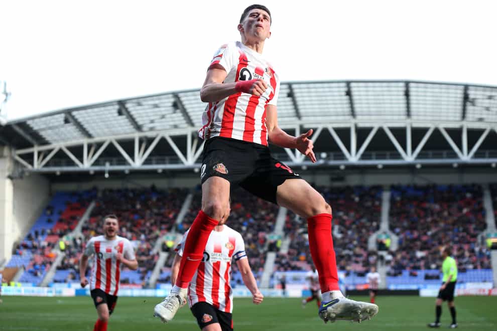 Ross Stewart celebrates his penalty in Sunderland’s win at Wigan (Barrington Coombs/PA)
