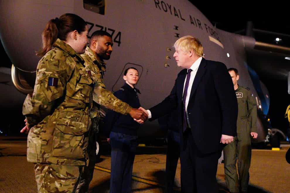 Boris Johnson meeting military personnel at RAF Brize Norton (Ben Birchall/PA)
