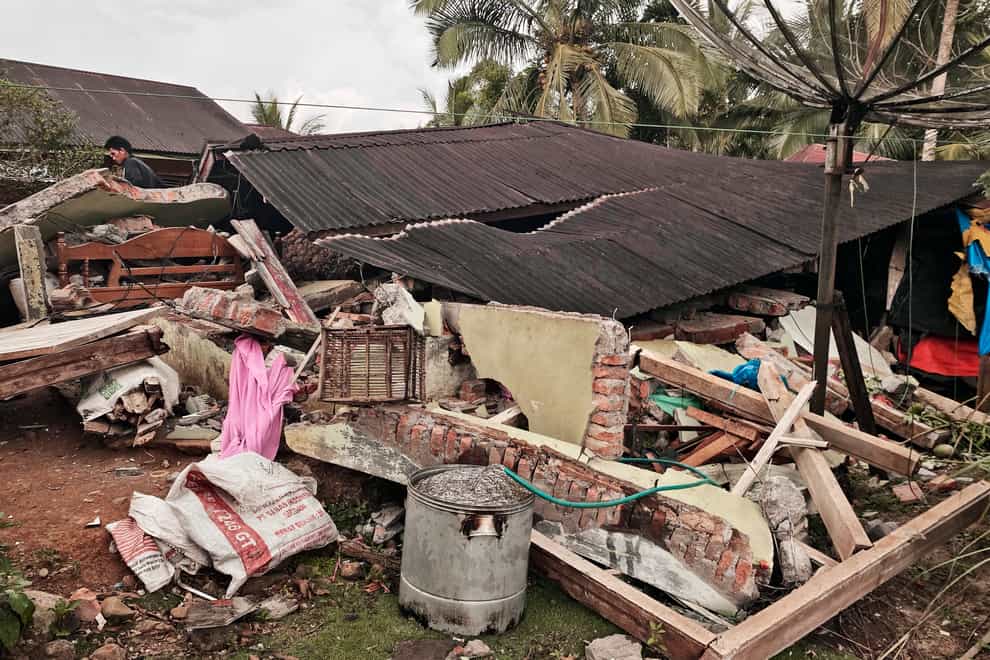 A house damaged by an earthquake in Talamau, West Sumatra, Indonesia (Suryo Wibowo/AP)