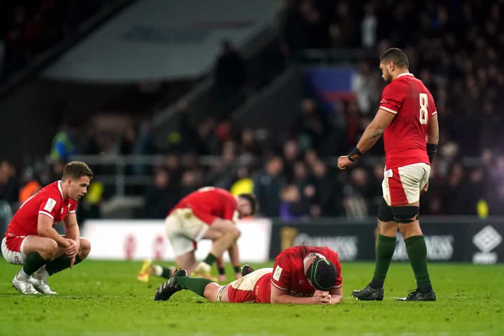 Dejected Wales players after the final whistle at Twickenham (PA)