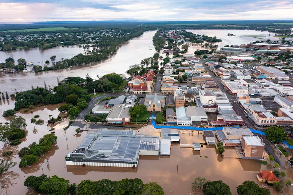 Water floods streets and houses in Maryborough, Australia (Queensland Fire and Emergency Services via AP)
