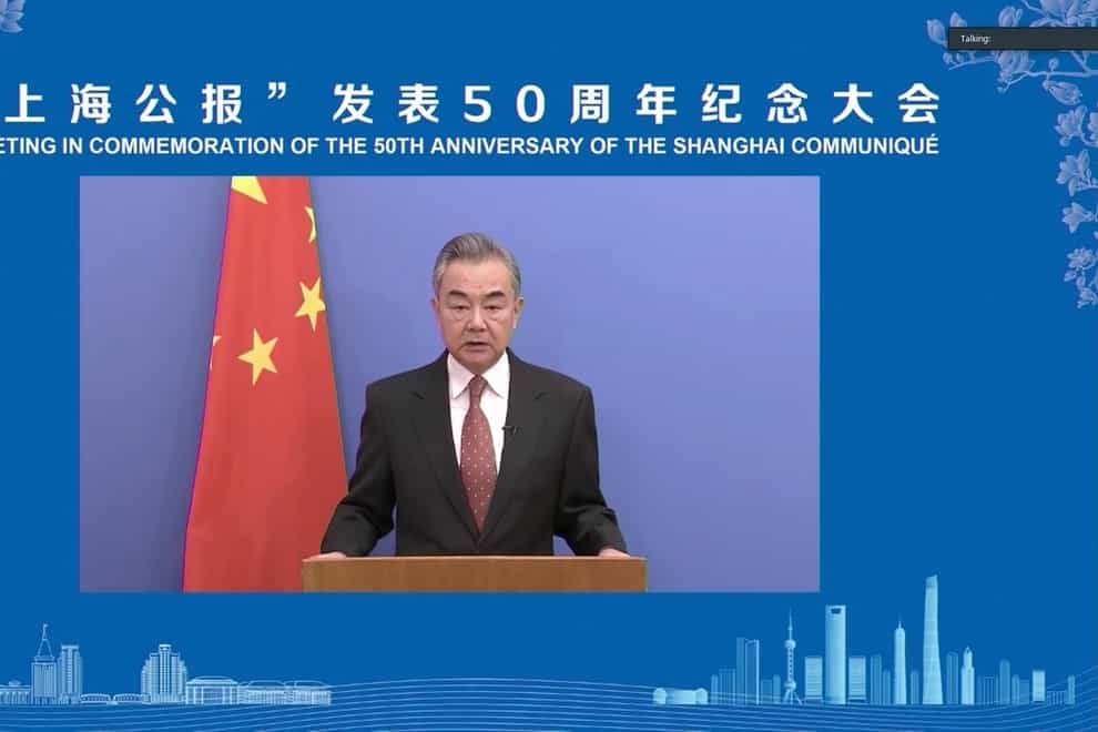 Chinese foreign minister Wang Yi delivers an address during a forum marking the 50th anniversary of the Shanghai Communique (Chinese People’s Association for Friendship with Foreign Countries via AP)