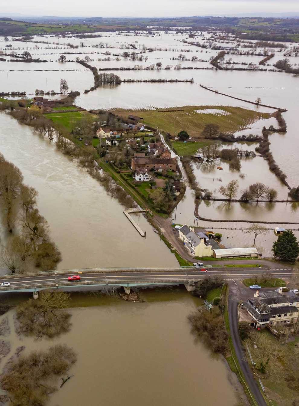 The number of people hit by heavy rain and river flooding and the costs of resulting damage could double if temperatures climb to 3C above pre-industrial levels, a report warns (Ben Birchall/PA)