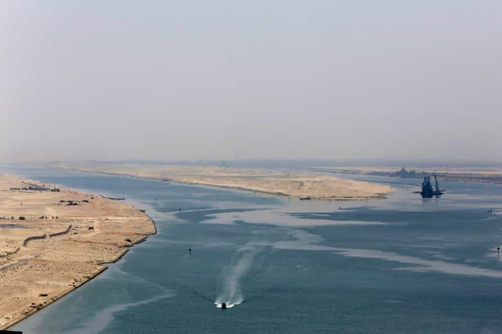 An army zodiac secures the entrance of a new section of the Suez Canal in Ismailia, Egypt (Amr Nabil/AP)
