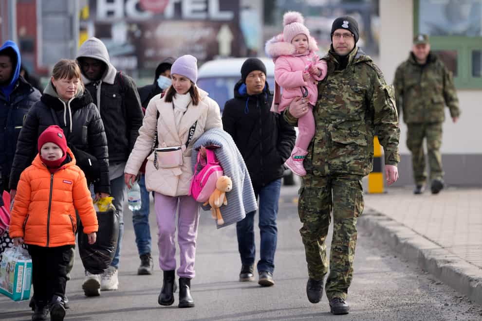 Refugees from Ukraine cross into Poland at the Medyka crossing (MArkus Schreiber/AP)