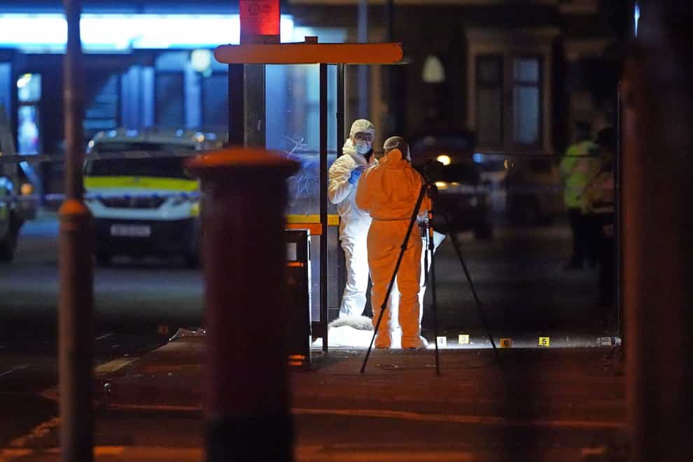 Forensic investigators at the scene of the shooting in Toxteth, Liverpool (Peter Byrne/PA)