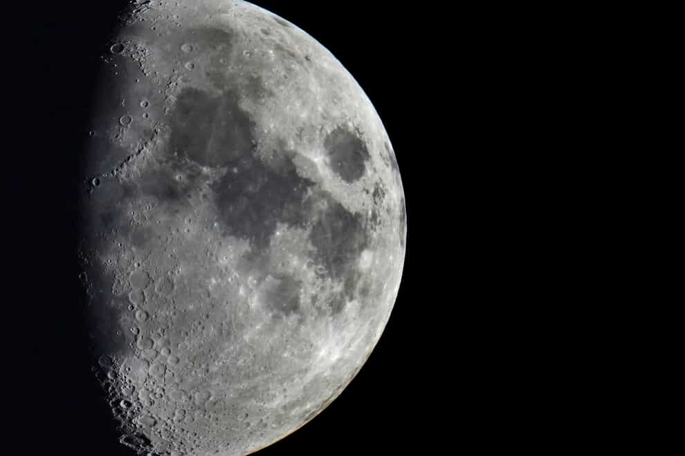 Impact craters cover the surface of the moon (Michael Sohn/AP)
