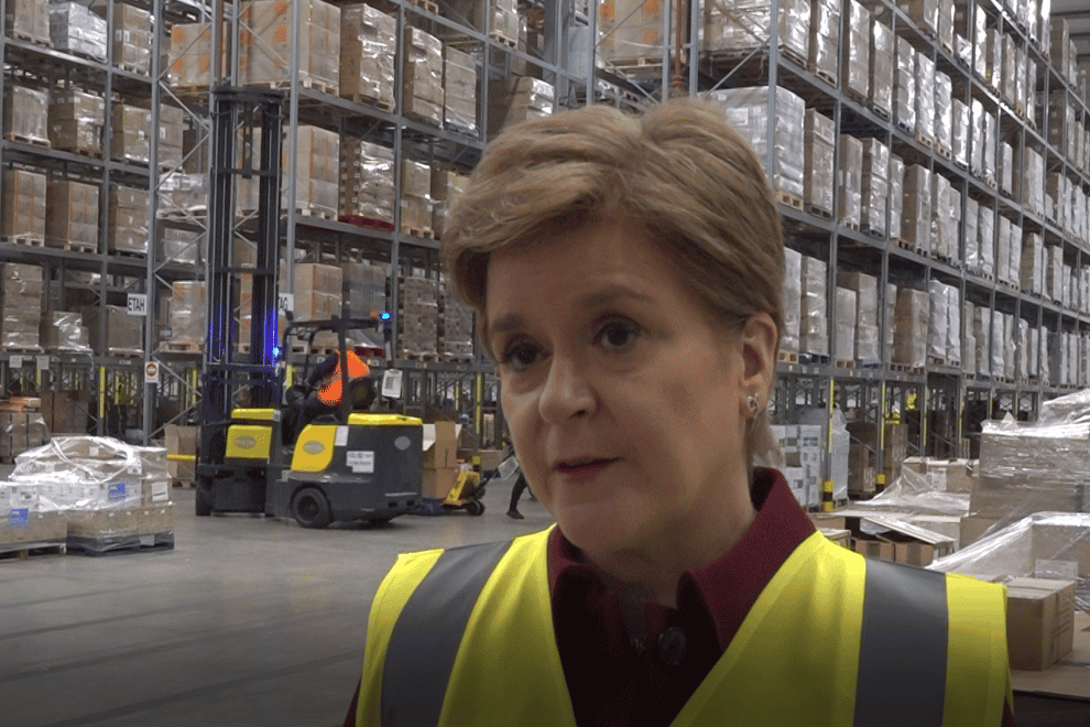 First Minister Nicola Sturgeon at an NHS National Services Scotland warehgouse as 500,000 items are packed to be sent to Ukraine (Tom Eden/PA)