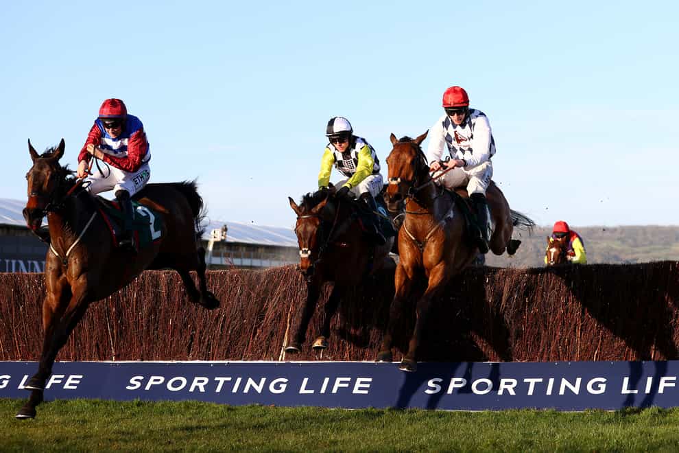 Escaria Ten (left) ridden by Adrian Heskin in the Sam Vestey National Hunt Challenge Cup Novices’ Chase at the Cheltenham Festival (Michael Steele/PA)
