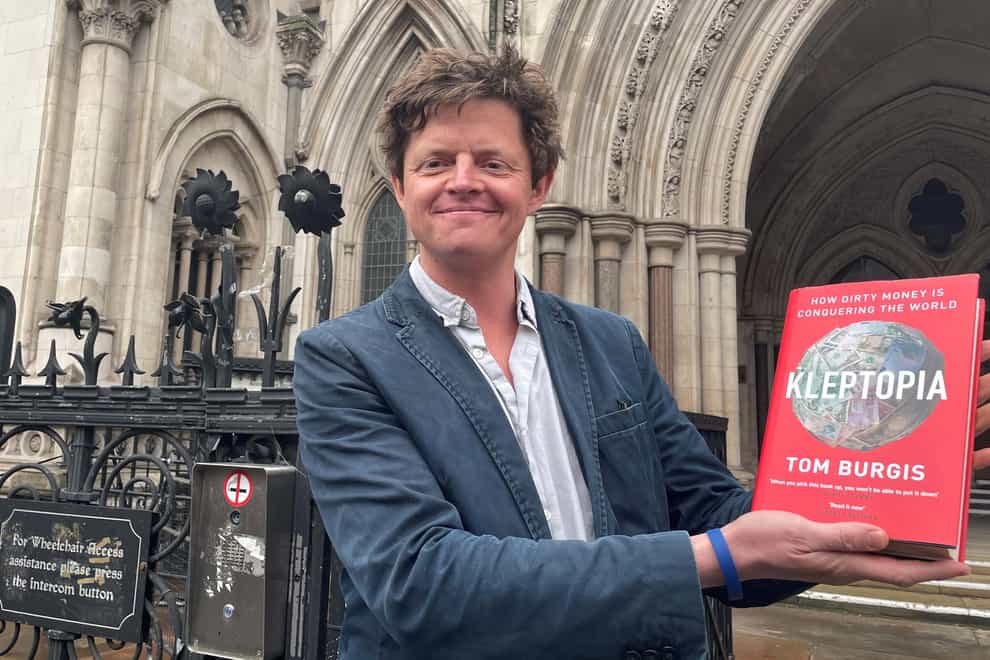Tom Burgis outside of the Royal Courts of Justice in London after a high court judge dismissed a libel claim against him over his book, Kleptopia: How Dirty Money is Conquering the World. Eurasian Natural Resources Corporation (ENRC) sued the Financial Times journalist Tom Burgis over his book first published by Harper Collins in September 2020. Picture date: Wednesday March 2, 2022.