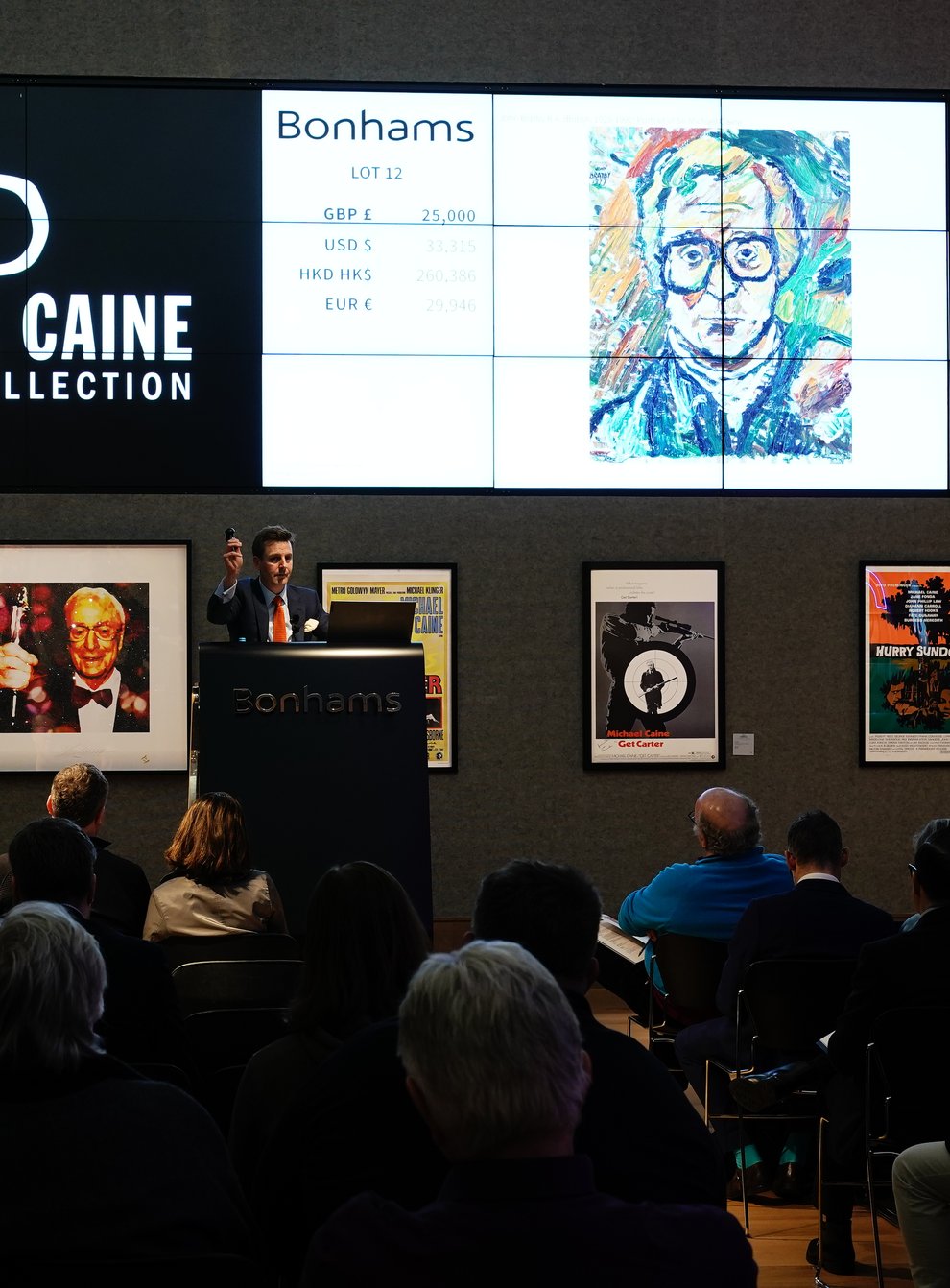 A portrait of Sir Michael Caine by artist John Bratby R.A. sells for £25,000 during the Sir Michael Caine collection sale at Bonhams in London. The sale contains a selection of items reflecting the breadth of Sir Michael’s career, ranging from movie posters, furniture including his desk, works of art and fine art (Aaron Chown/PA)