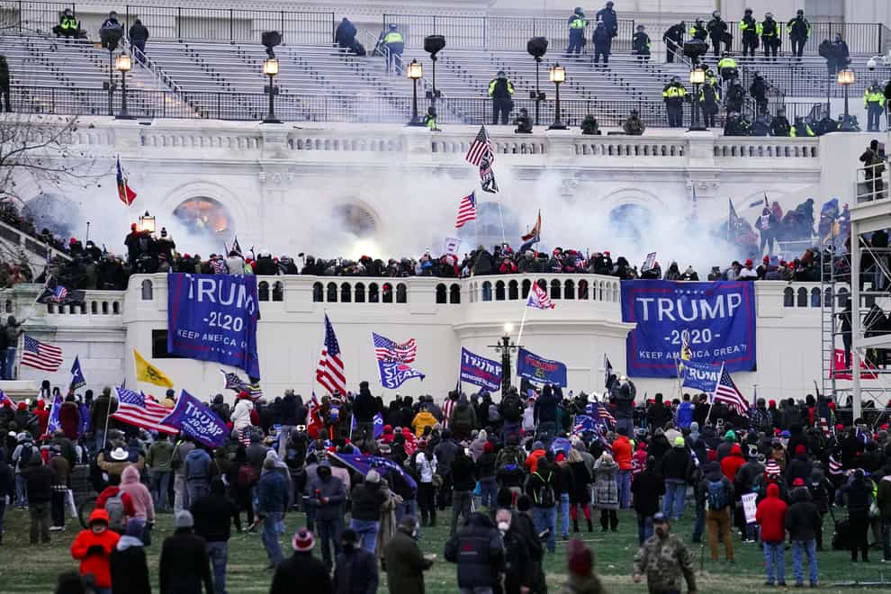 Violent insurrectionists, loyal to President Donald Trump, storm the Capitol in Washington on January 6 2021 (John Minchillo/AP)