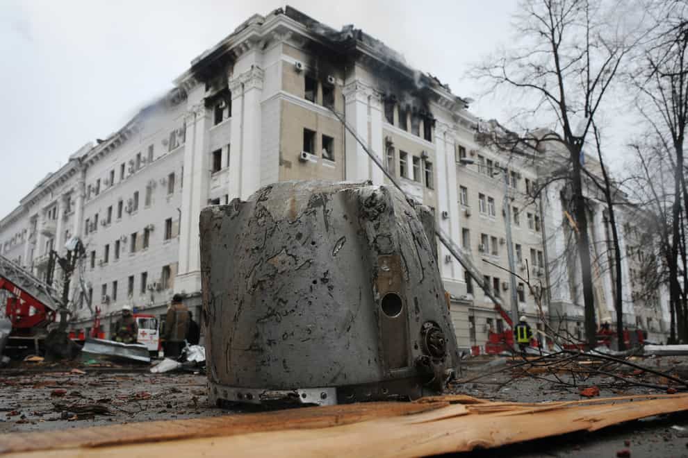 A rocket fragment lies on the ground next to a building of Ukrainian Security Service (SBU) after a rocket attack in Kharkiv, Ukraine’s second-largest city, on Wednesday March 2 2022 (Andrew Marienko/AP)
