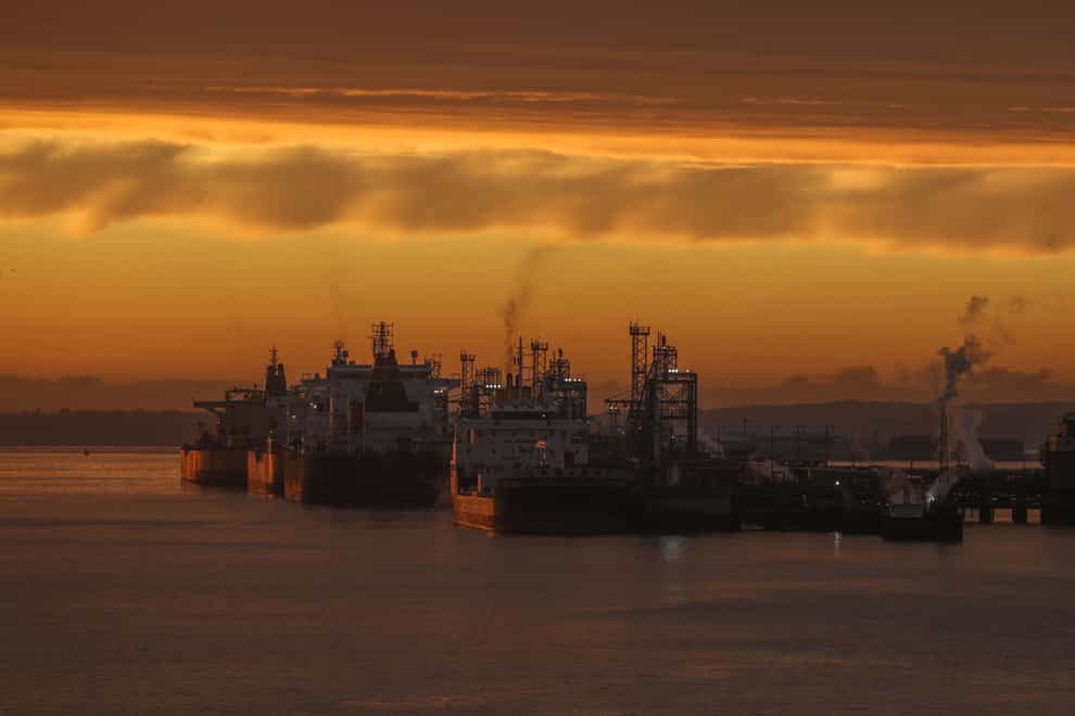 The sun rises over oil tankers (Steve Parsons/PA)