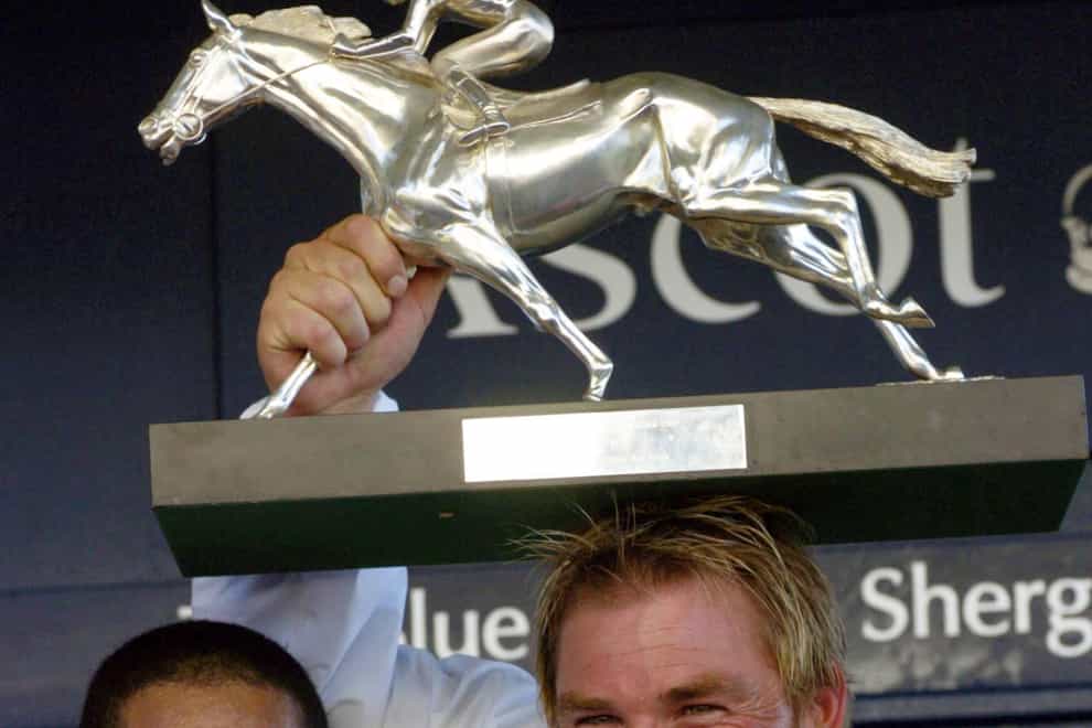 Shane Warne (right) as successful team captain for the Rest Of The World team in the Shergar Cup (Rebecca Naden/PA)