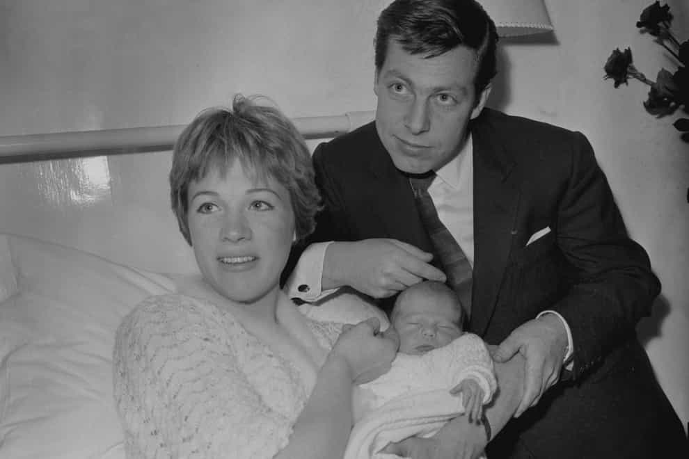 Julie Andrews pictured with Tony Walton and her baby daughter (PA Archive)