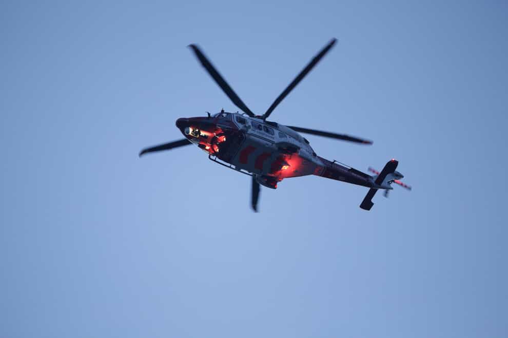 A coastguard helicopter was landing at a hospital when two elderly women were injured by the ‘down draft’ (Yui Mok/PA)