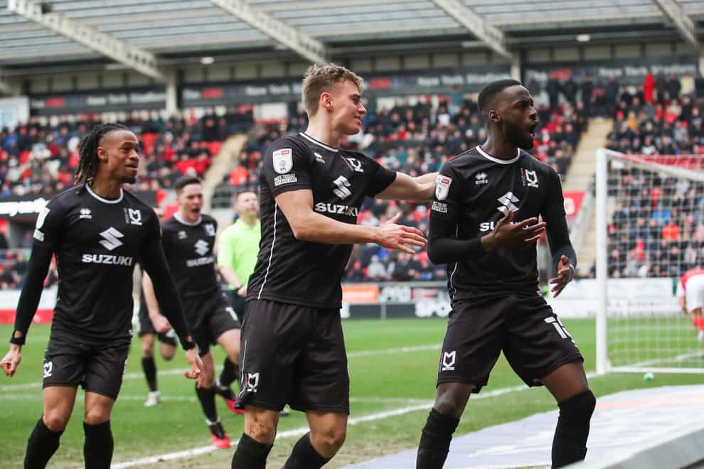 Mo Eisa, right. celebrates his goal in MK Dons’ win at Rotherham (PA)