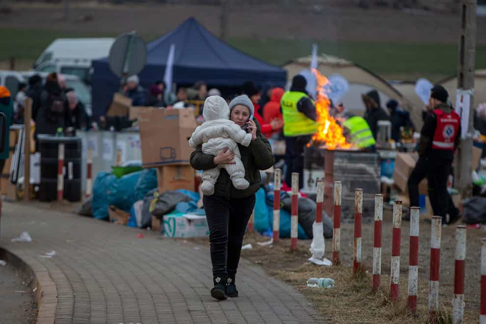 Ukrainian refugees arrive at the border crossing in Medyka, Poland (Visar Kryeziu/AP)