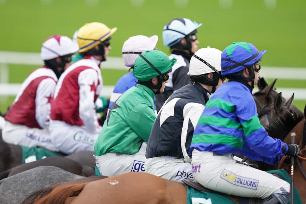 Runners and Riders wait to start ahead of NHS Vaccinating Heroes Conditional Jockeys’ Handicap Hurdle at Cheltenham racecourse. Picture date: Saturday October 23, 2021.