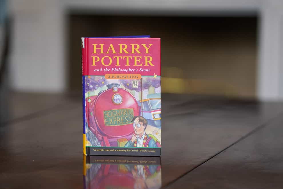 A near-perfect copy of the first edition hardback of JK Rowling’s Harry Potter And The Philosopher’s Stone (Jacob King/PA)
