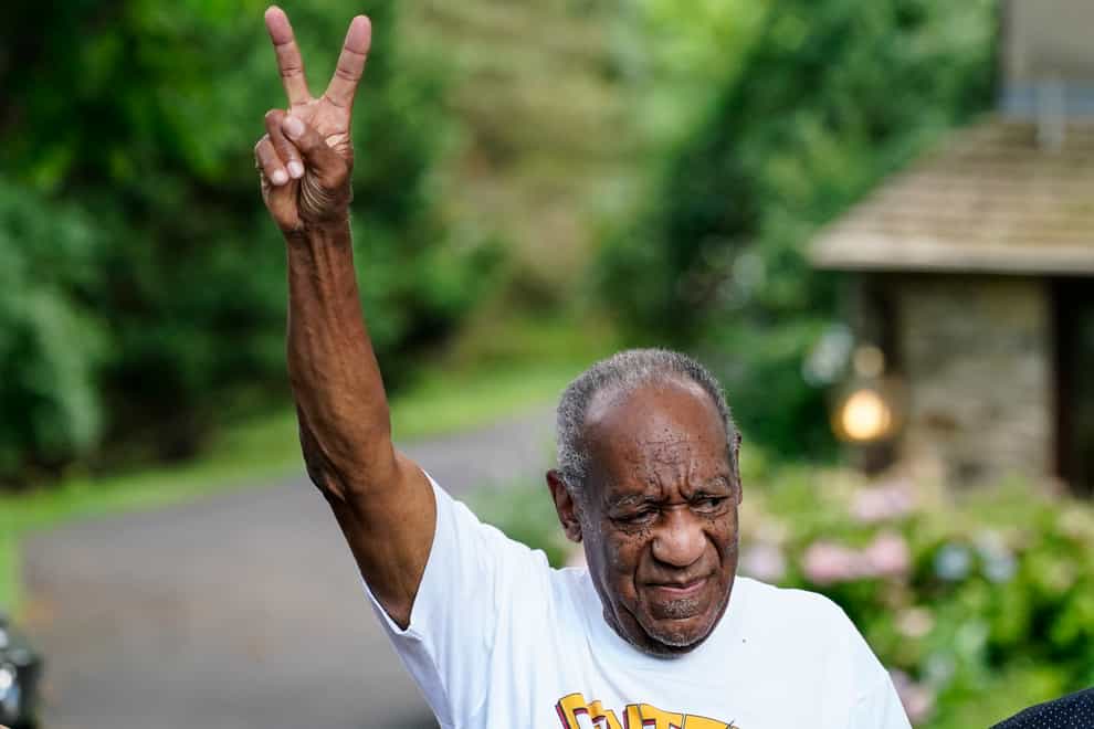 Bill Cosby gesturing outside his home after being released from prison (Matt Rourke/AP)