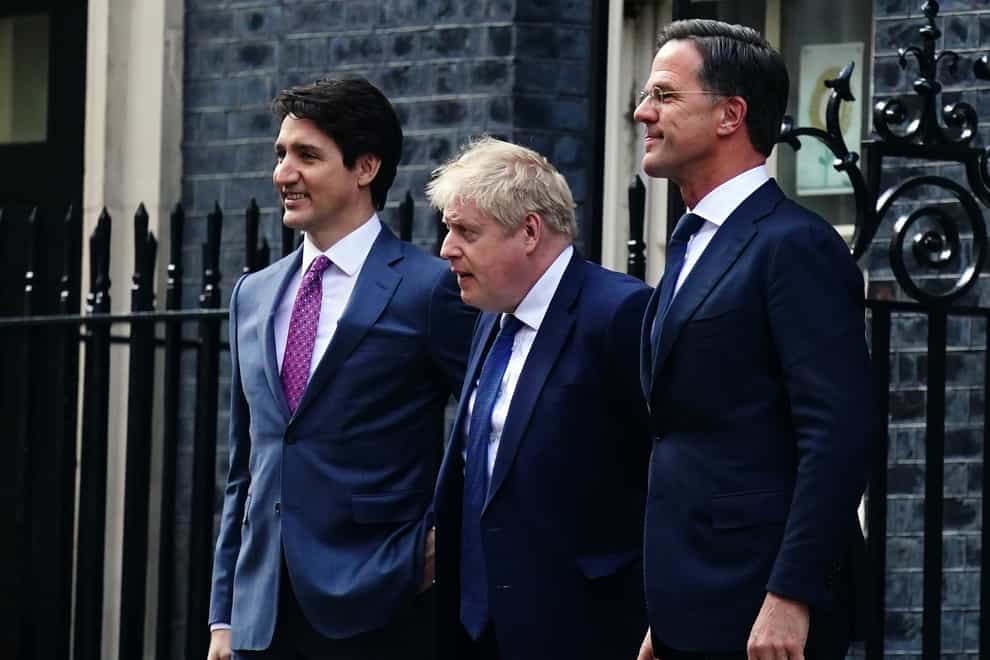 Boris Johnson with Canadian prime minister Justin Trudeau and Dutch prime minister Mark Rutte (Victoria Jones/PA)