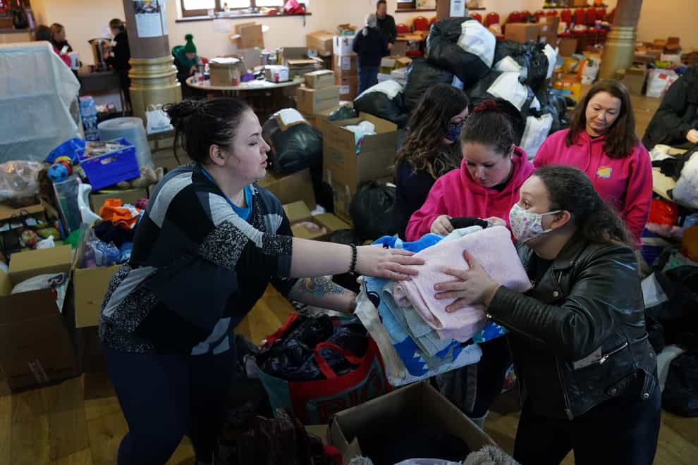 Volunteers from Rain or Shine, South Lanarkshire check through donations bound for Ukraine at Old Trinity Church in Cambuslang. Picture date: Monday March 7, 2022.