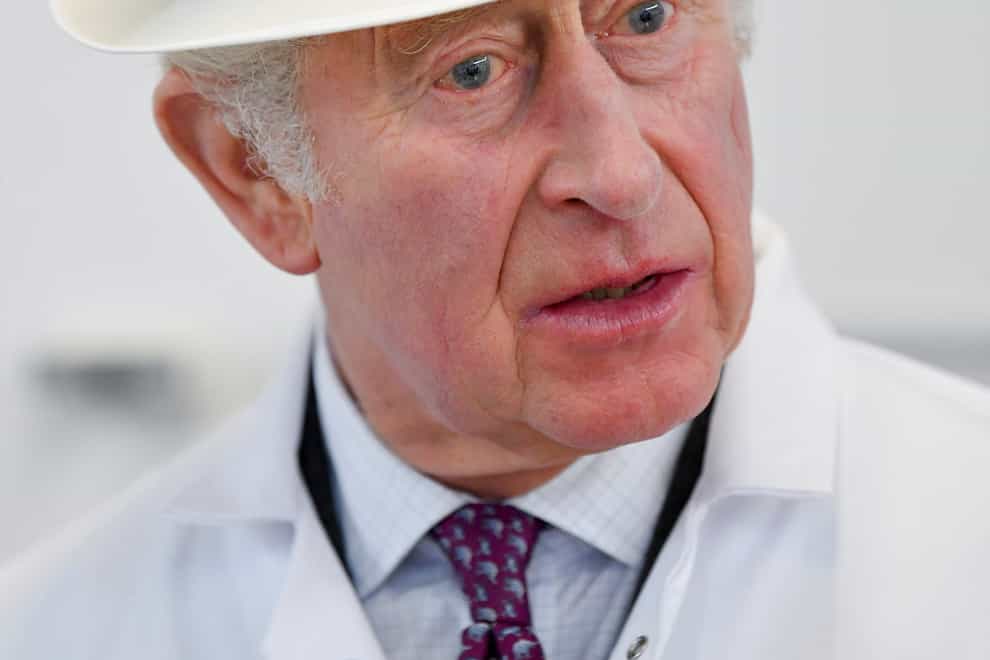 The Prince of Wales, who is also known as the Duke of Cornwall, speaks with cheesemakers in the nettling room during a visit to Lynher Dairies Cheese Company in Cornwall. Picture date: Monday March 7, 2022.