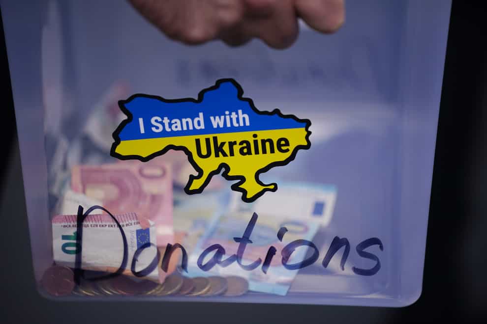 People collect financial donations during a protest against the Russian war in Ukraine in Dublin city centre on Saturday. Nearly 2,000 Ukrainians have already arrived in Ireland (Niall Carson/PA)