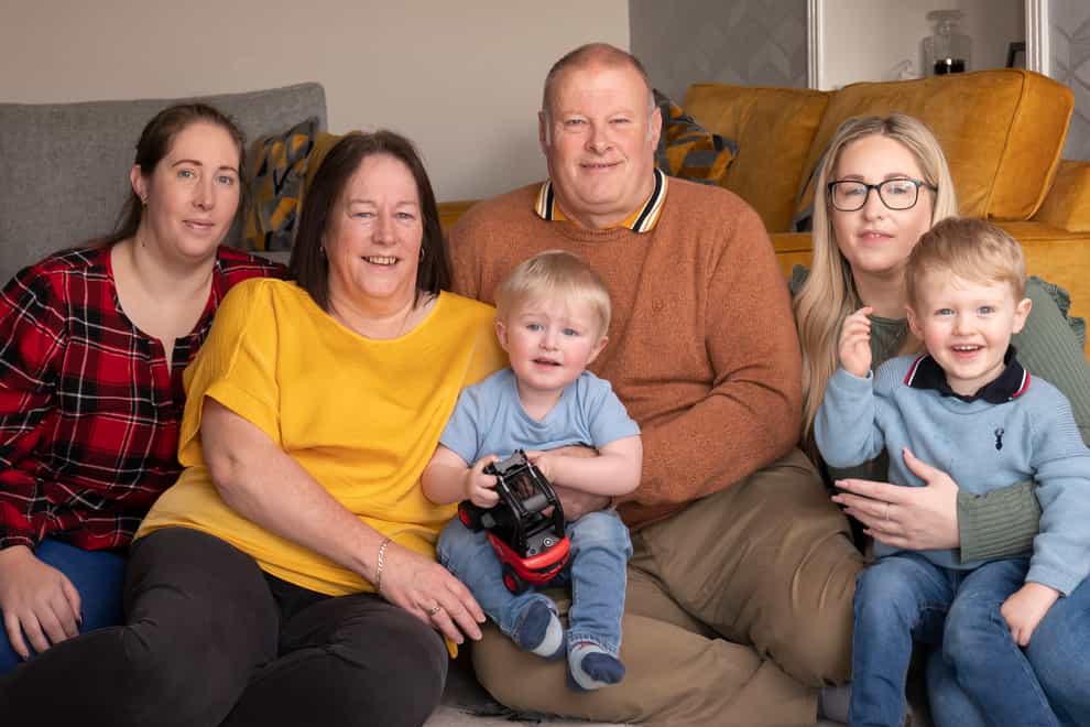 Grandparents Ruth Chalmers (2nd left) and Mark Chalmers (3rd left) with their daughterLeanne Chalmers (left) and Natalie Chalmers (right), and the two grandchildren Brogen Chalmers (front left) and Koby Armitage (front right) after the grandparents, who scooped a £1 million a lottery windfall, say they now feel like double winners after they were able to help both daughters have children through IVF (Danny Lawson/PA)