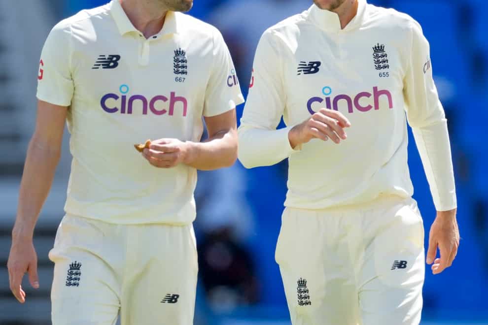 Wood (left) says England are trying too hard to fill hole left by Anderson and Broad (AP Photo/Ricardo Mazalan)