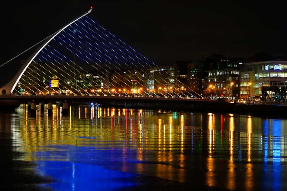 The Samuel Beckett Bridge in Dublin’s city centre displays the colours of the Ukrainian flag as a show of support. Blood bags and medical masks have been sent to Ukraine by Ireland (Brian Lawless/PA)