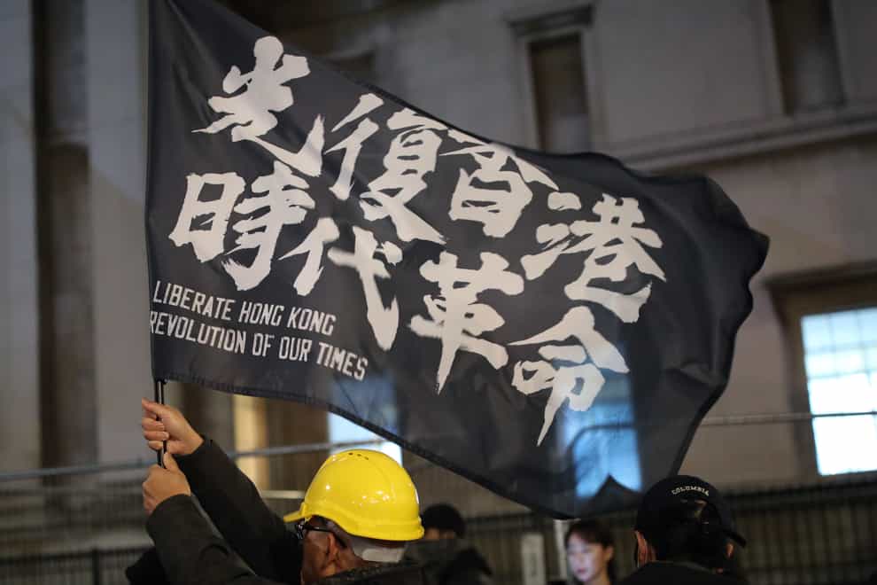 Hong Kong pro-democracy protesters taking part in a Hong Kong solidarity rally in Trafalgar Square, London (Yui Mok/PA)