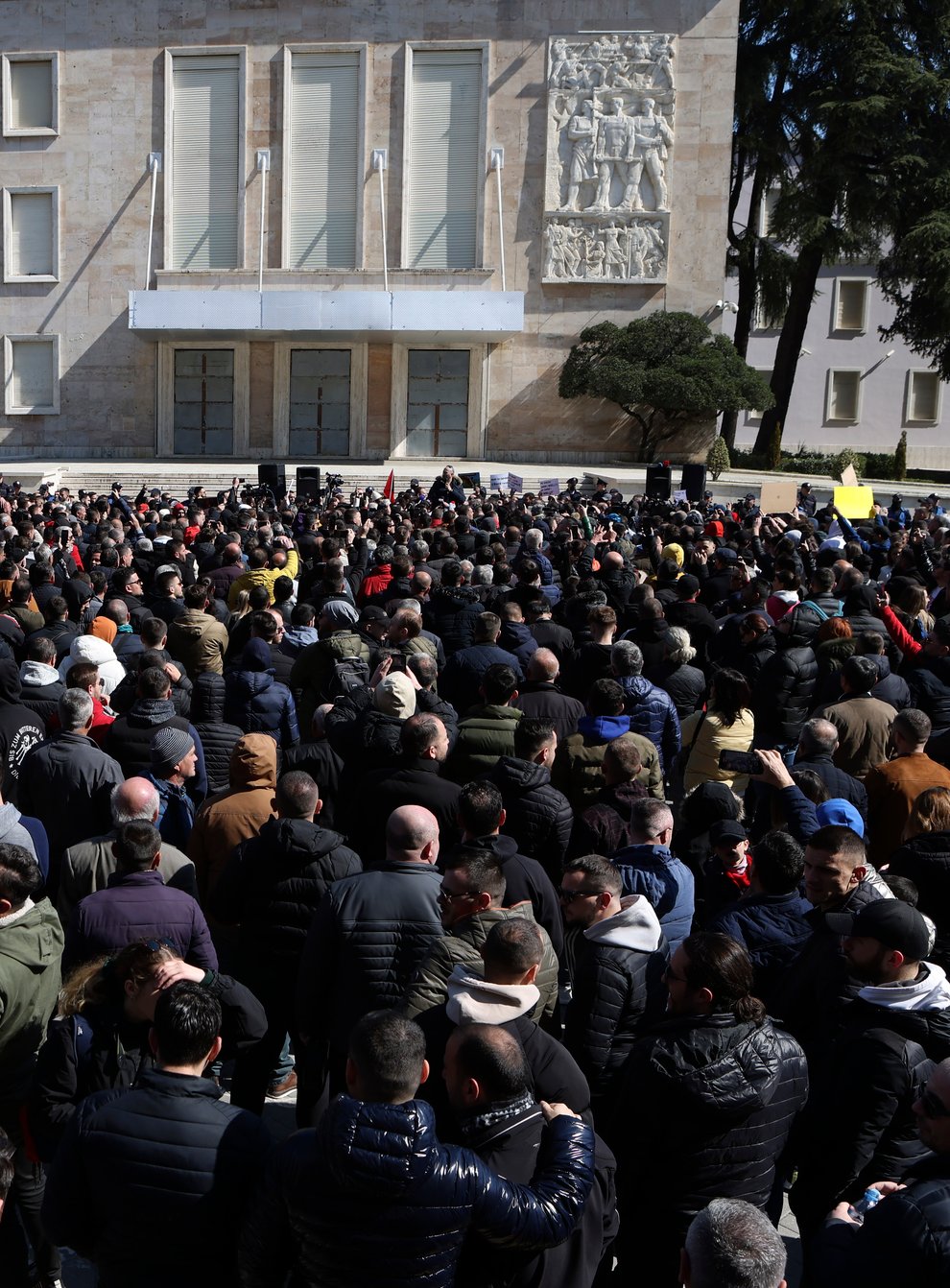 Protesters gather outside Prime Minister’s office during an anti-government rally in Tirana, Albania, Saturday, March 12, 2022. Thousands of Albanians are holding on Saturday a protest in the capital Tirana against recent price hikes that authorities blame on the war in Ukraine. (AP Photo/Franc Zhurda)