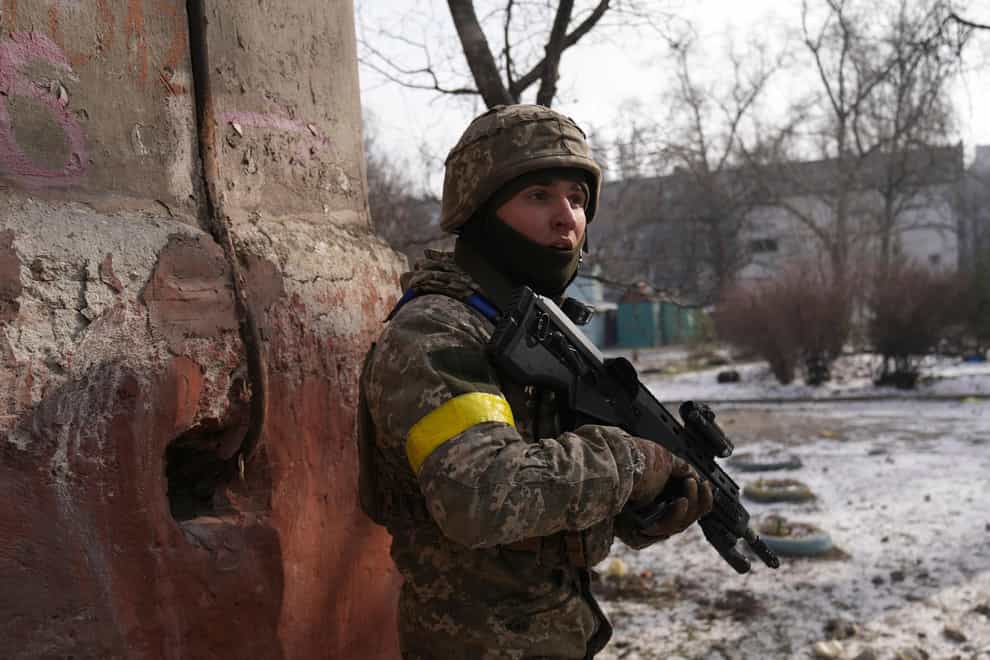 A Ukrainian serviceman guards his position in Mariupol (Evgeniy Maloletka/AP)