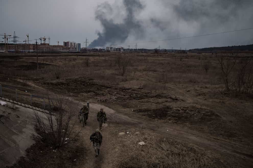 Smoke billows from the town of Irpin, on the outskirts of Kyiv (Felipe Dana/AP)