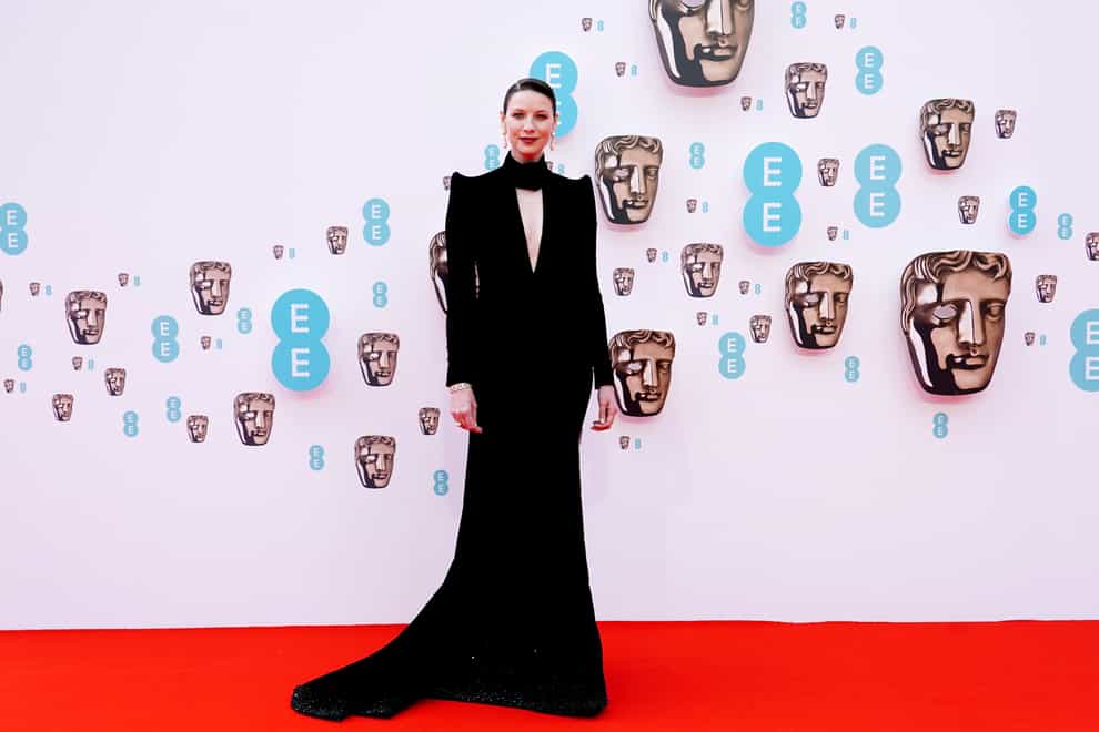Caitriona Balfe wore a black velvet dress with slicked-back hair and pearl drop earrings (Ian West/PA)
