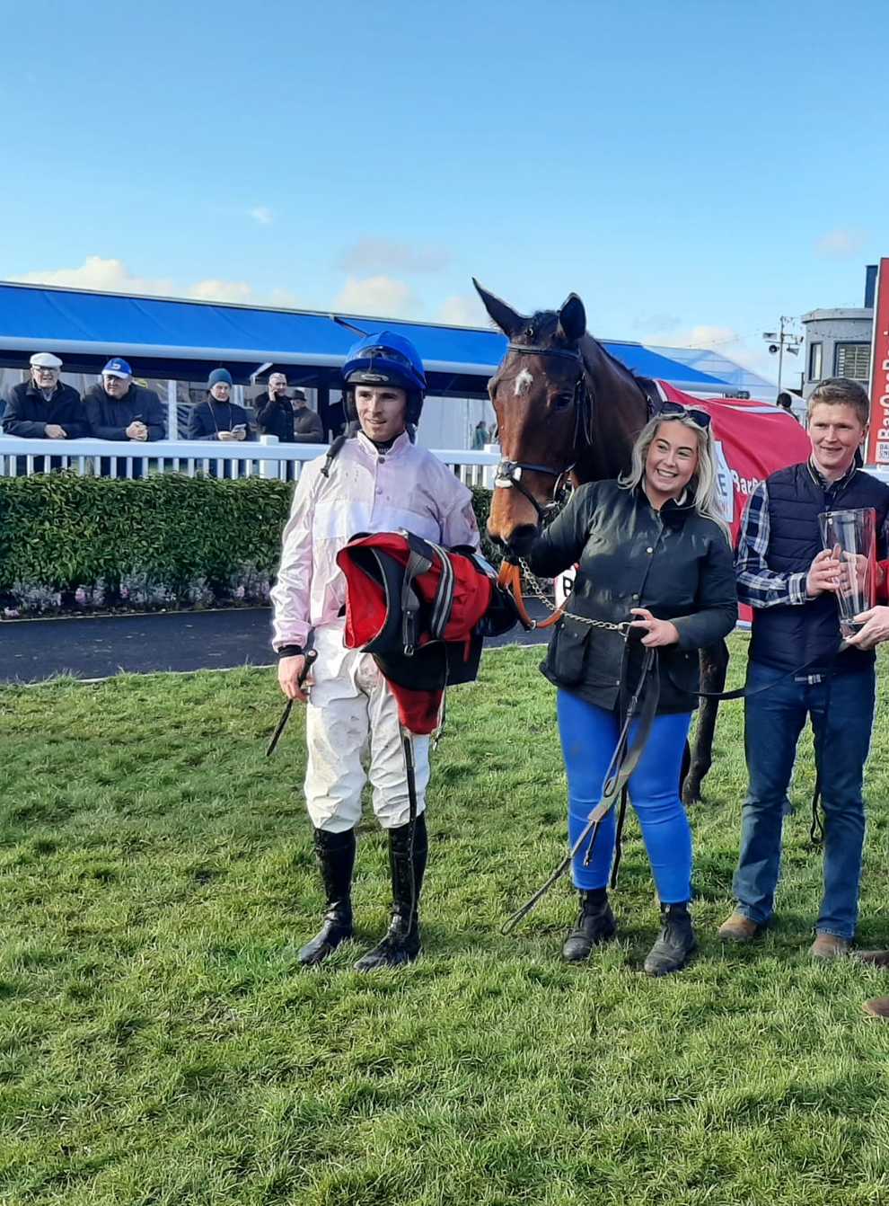 Delvino with delighted connections after his Grade Three victory at Naas (PA)