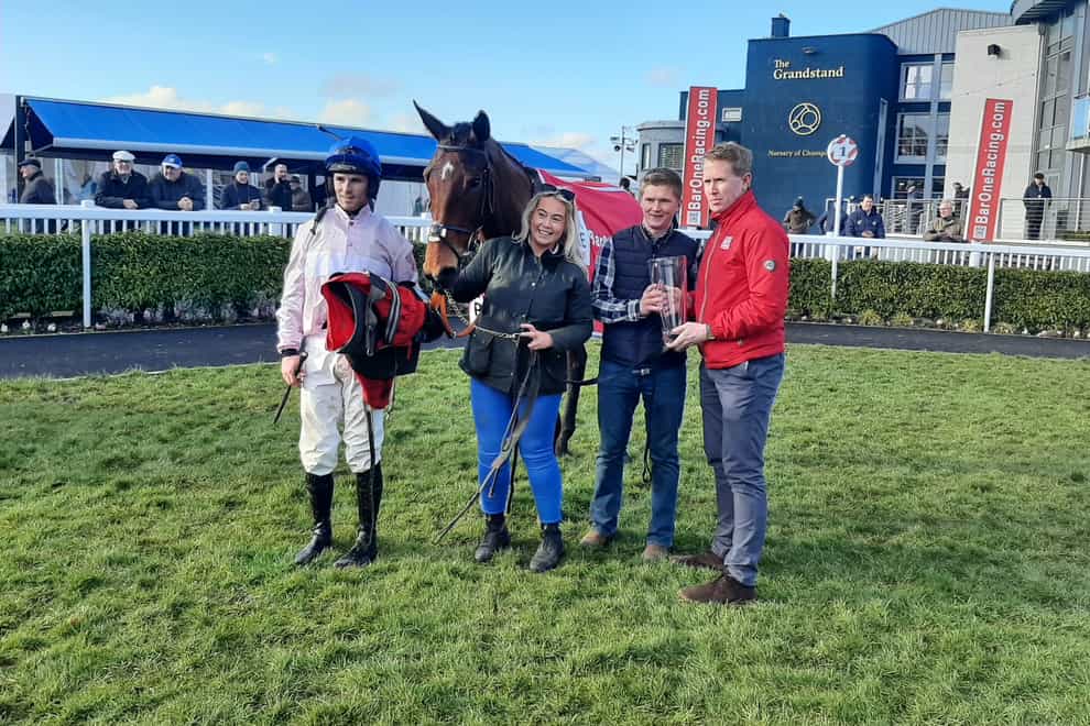 Delvino with delighted connections after his Grade Three victory at Naas (PA)