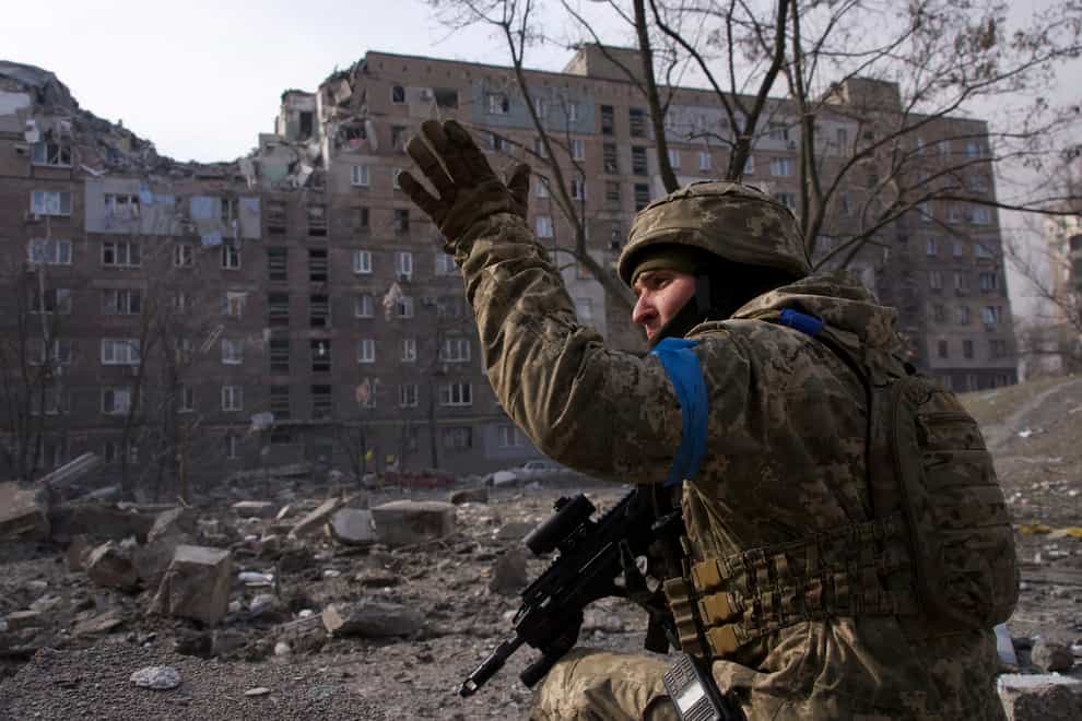 A Ukrainian serviceman guards his position in Mariupol, Ukraine (Mstyslav Chernov/AP)