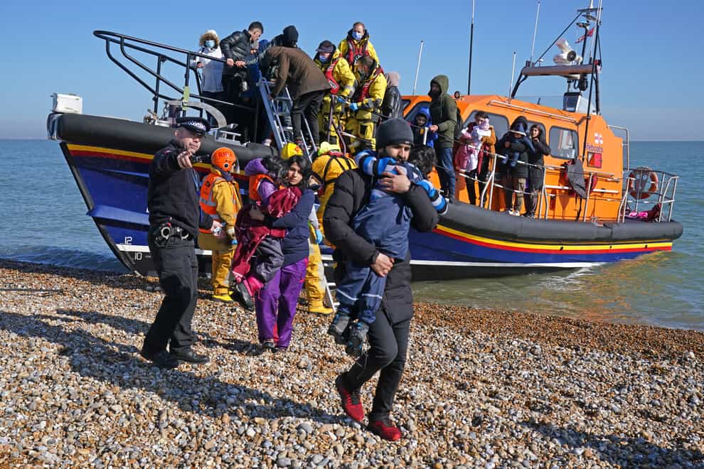 A group of people thought to be migrants are brought in to Dungeness, Kent, by the RNLI following a small boat incident in the Channel on Tuesday (Gareth Fuller/PA)