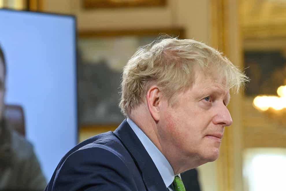 Prime Minister Boris Johnson listens as Ukrainian President Volodymyr Zelensky addresses by video link leaders attending a summit of the Joint Expeditionary Force in London (Justin Tallis/PA)
