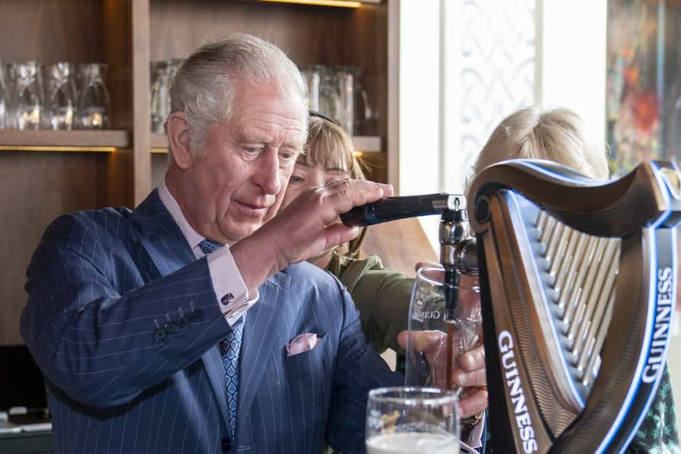 The Prince of Wales pours a pint of Guinness (Arthur Edwards/The Sun/PA)