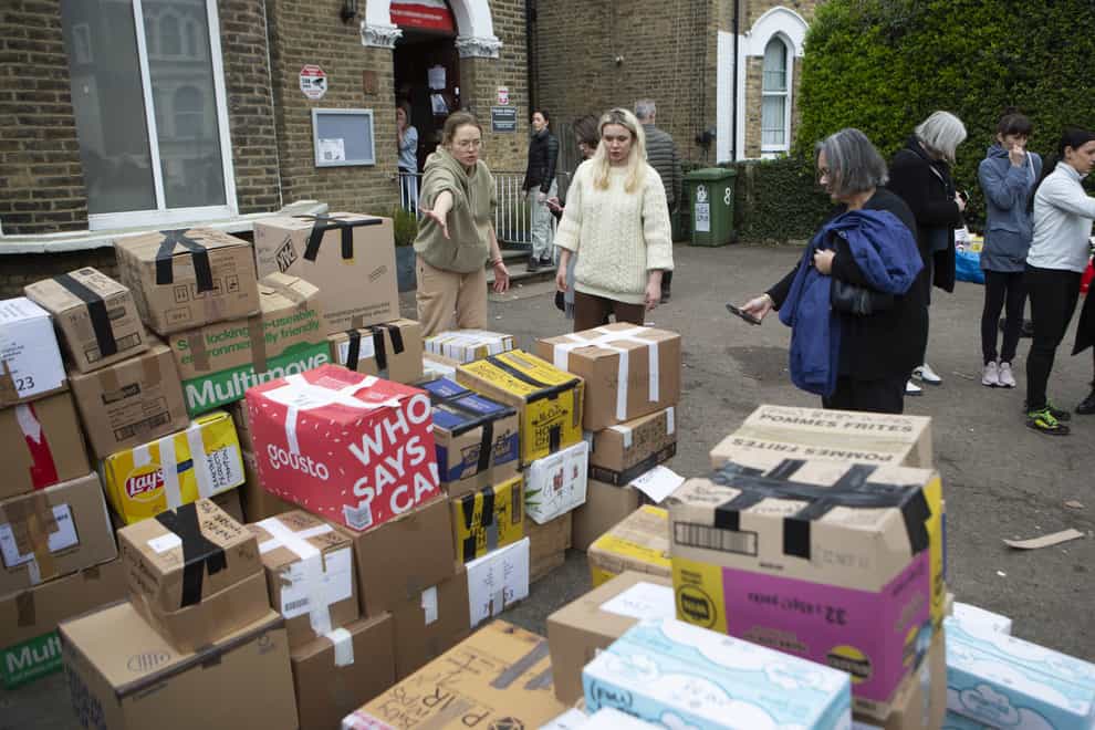 Volunteers at the Lewisham Polish Centre prepare to load up a van with donations for Ukrainian refugees (Rick Findler/PA)