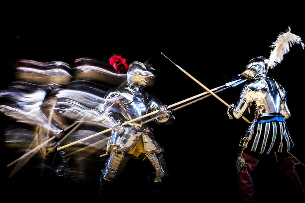 EDITORS NOTE EFFECT CREATED USING IN CAMERA MULTIPLE EXPOSURE FUNCTION SLOW SHUTTER SPEEDS AND FLASH. Knights fight during an armoured combat demonstration, part of the Elizabethan bank holiday event at the Royal Armouries in Leeds.
