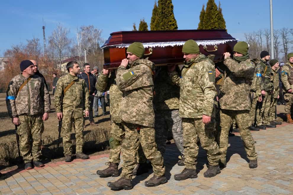 The comrades of a Ukrainian officer killed in the fighting against Russia carry the coffin at his funeral (AP Photo/Efrem Lukatsky)