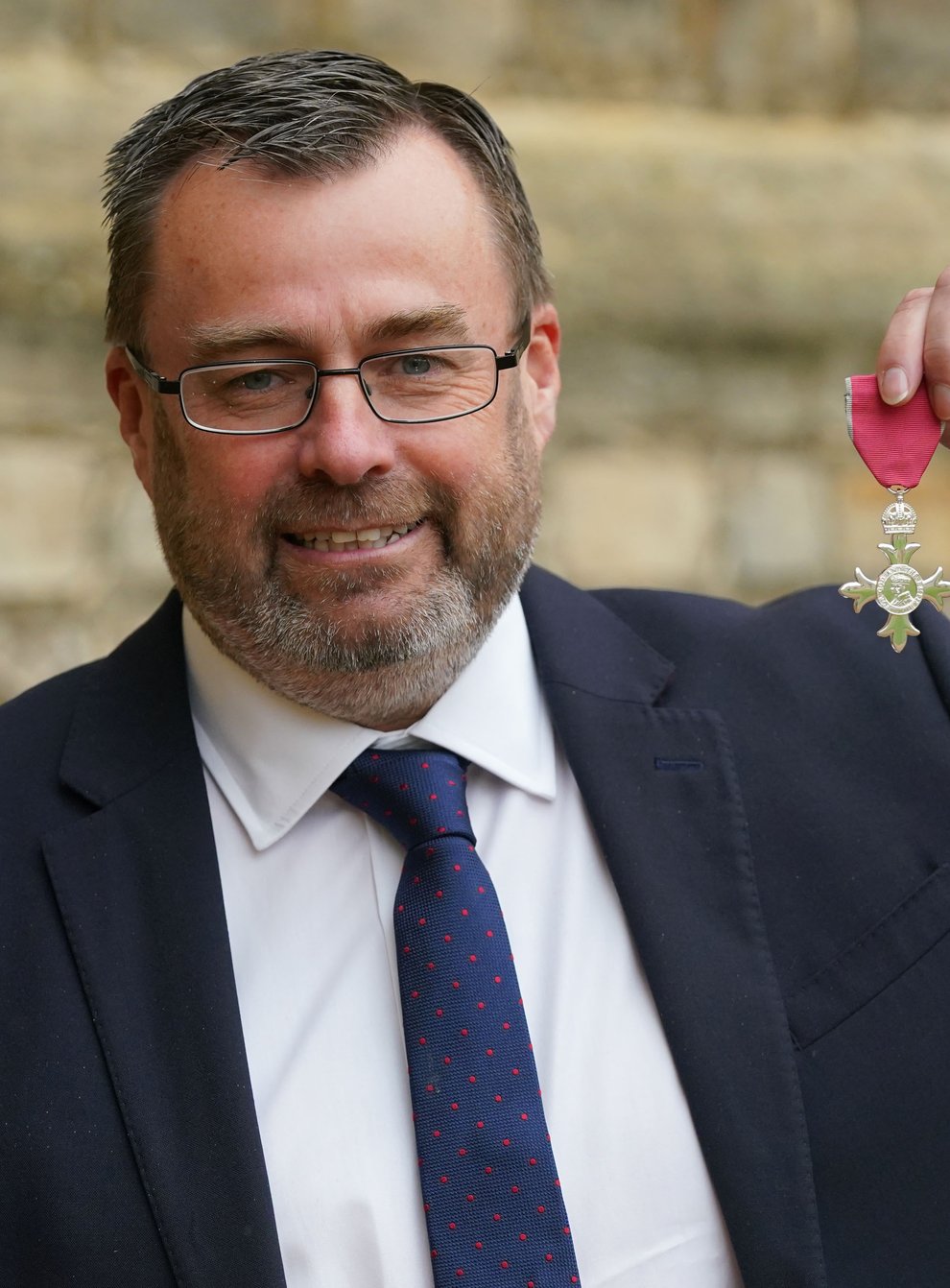 Martyn Phillips shows off his MBE (Jonathan Brady/PA)