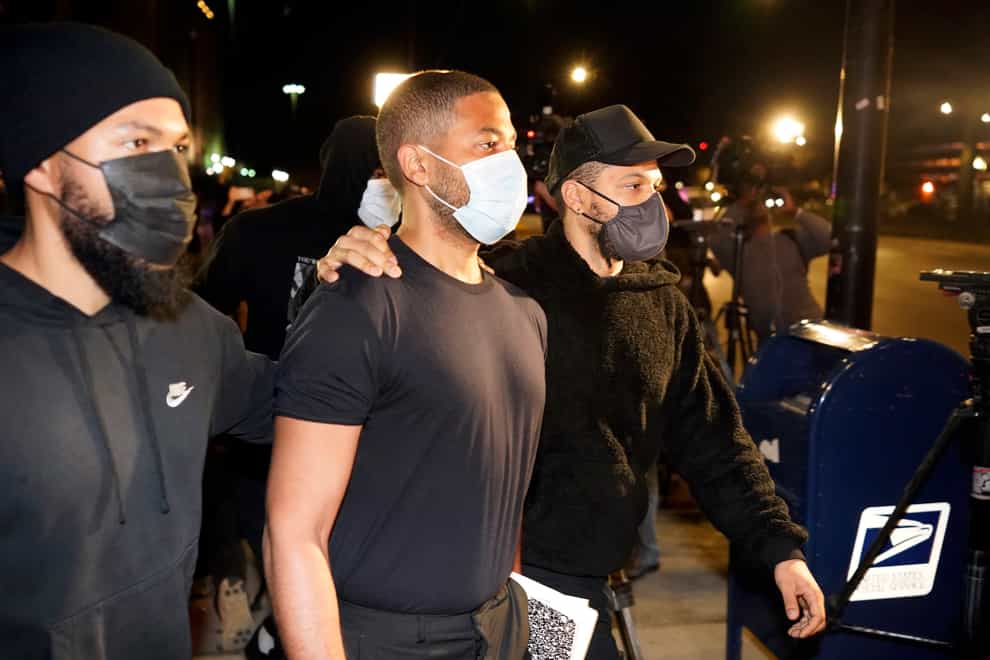 Actor Jussie Smollett, centre, leaves the Cook County Jail (AP Photo/Charles Rex Arbogast)